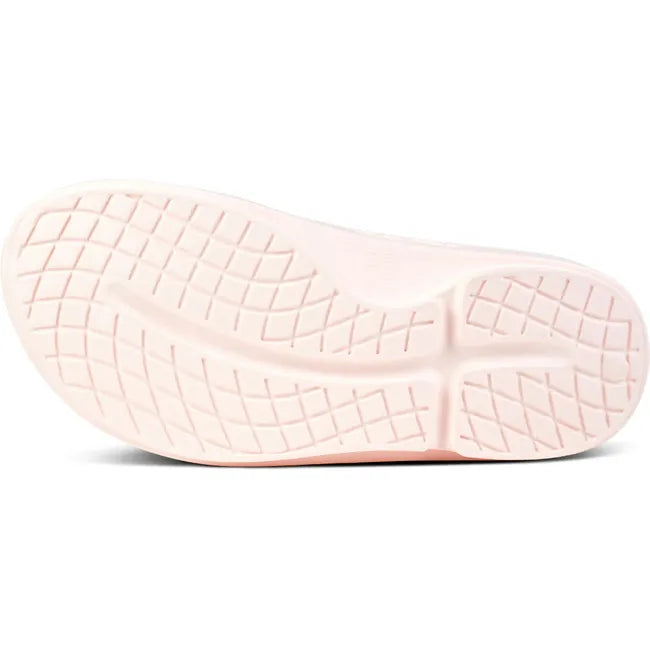 Sole of Unisex OOfos OOahh Slide Sandal in Blush Pink