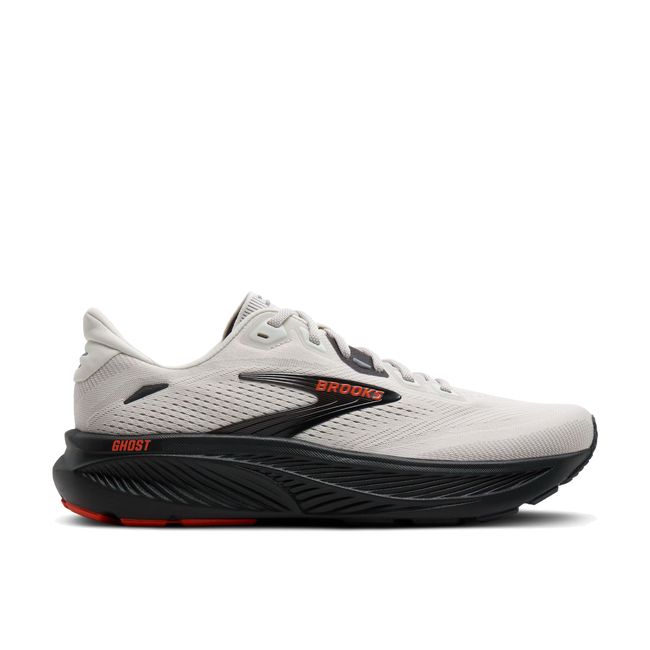 Lateral profile of Brooks Ghost 18 men's shoe in white showing black cushioned midsole and orange accent