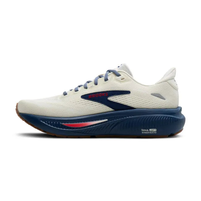 Medial profile of Brooks Ghost 18 in coconut white and navy blue showing cushioned midsole and Brooks branding