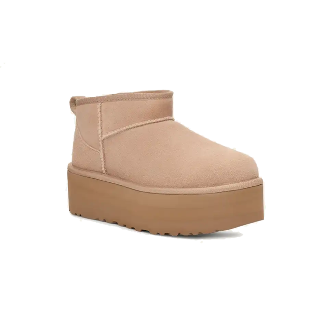 Angled side of UGG Women's Classic Ultra Mini in Sand Beige Suede