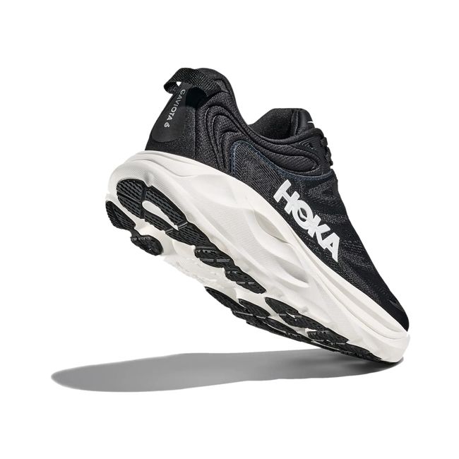 Hoka Womens Gaviota 6 running shoe in Black/White, angled outsole and heel tread detail