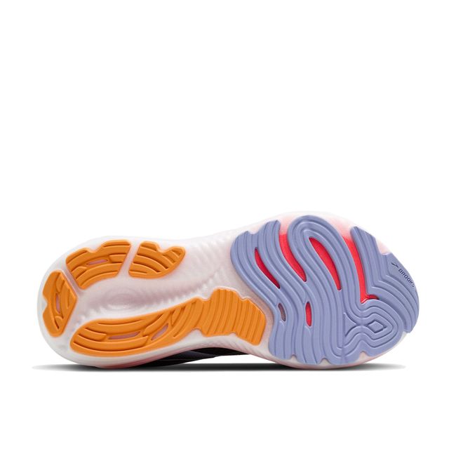 Sole of Brooks Women’s Glycerin 22 running shoe in black, blue, and pink with cushioned midsole