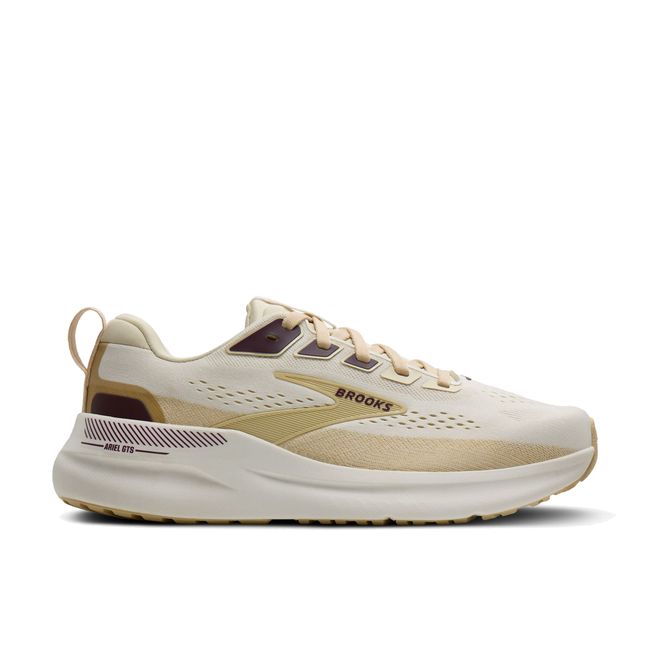 Lateral profile of Brooks Ariel GTS 26 women's shoe in coconut showing white cushioned midsole and tan overlay detail