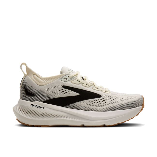 Lateral profile of Brooks Glycerin 23 women's shoe in white showing gum outsole and black speckled knit upper