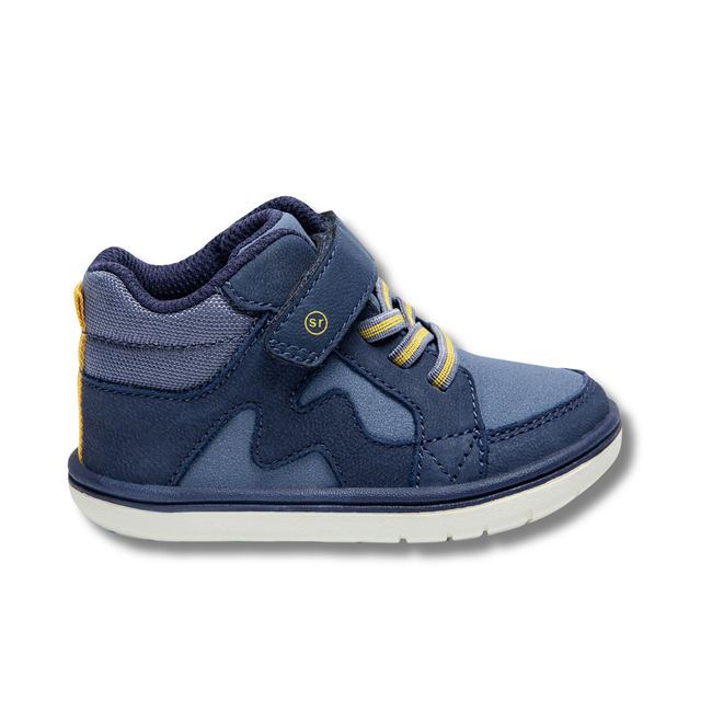 Lateral side of Stride Rite Kids' Ames High Top Sneaker in Navy with velcro strap