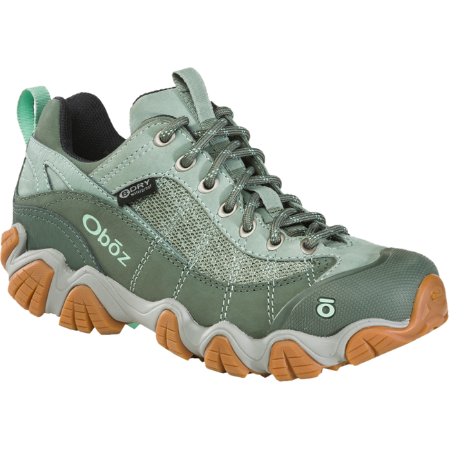 Front angled view of Women's Oboz Firebrand II Low Hiking Shoe in pale moss green with tan tread