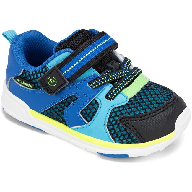 Stride Rite Velocity sneaker in black and royal blue with neon yellow trim, angled view