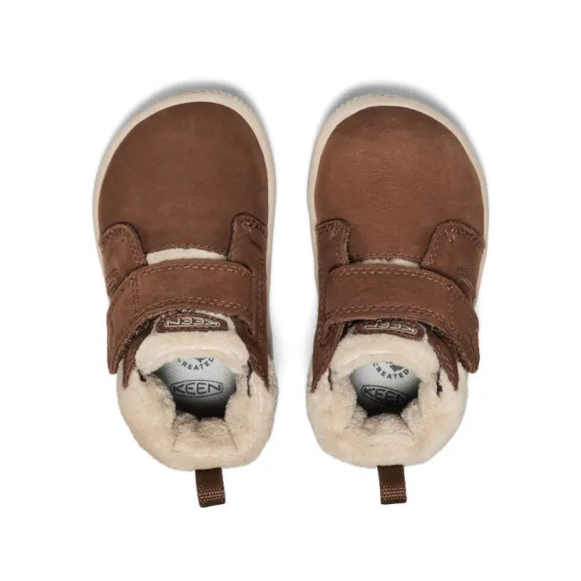 Velcro upper of KEEN Toddlers’ KNX Middie Boot in brown with white faux wool