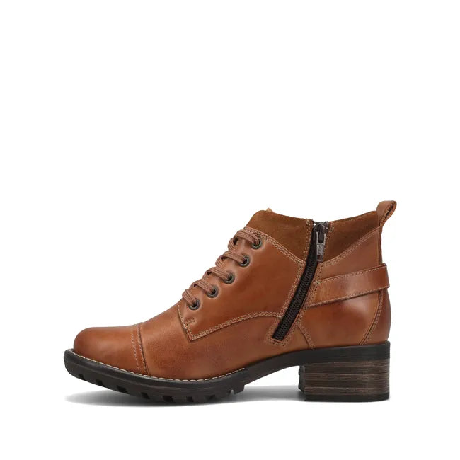 Medial side of Womens Taos Mini Crave Boot in caramel leather. Lace up closure and side zipper