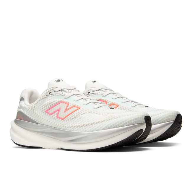 Pair of New Balance 1080v15 Breathe running shoes in white and coral pink