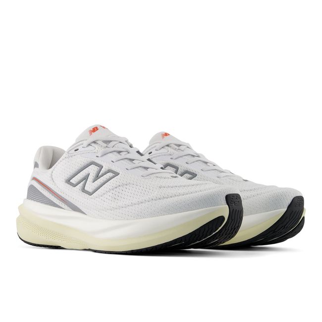 New Balance 1080 V15 running shoes in white and orange, top-down pair view.
