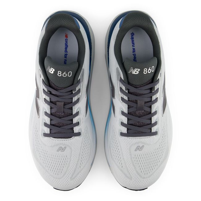 Top down view of the New Balance 860 pair in pale grey engineered mesh