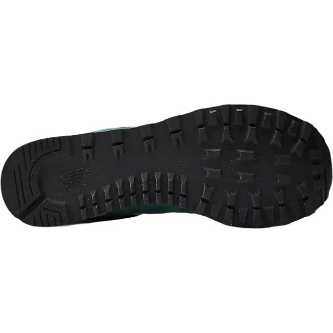 Sole of New Balance Unisex 574 Lifestyle Shoe in new spruce green upper with black tread