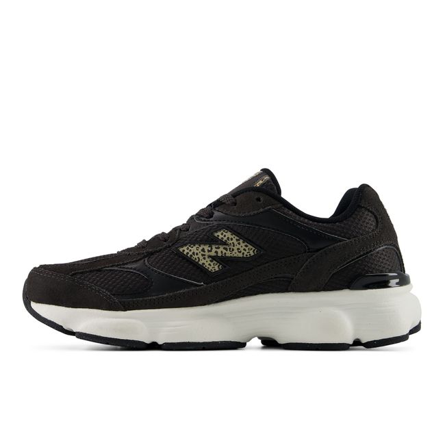 New Balance Women's 603 sneaker in black, medial profile
