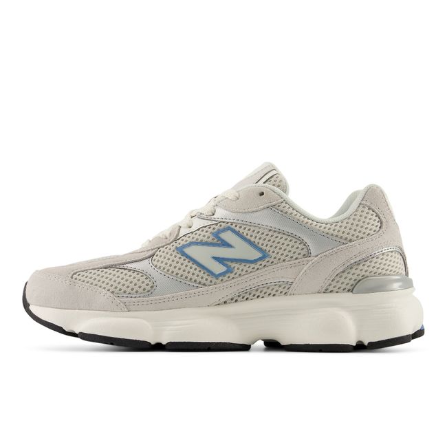 Medial profile of the New Balance 603 in pale grey with a dusty blue N
