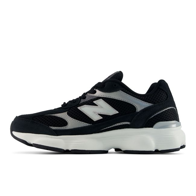 New Balance 603 sneaker in black, medial profile.