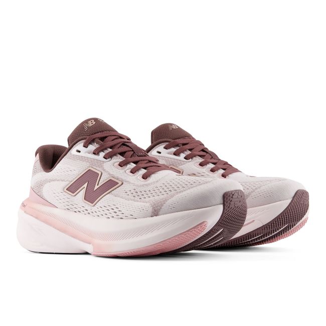 Pair of New Balance 860v15 stability running shoes in pale pink and maroon
