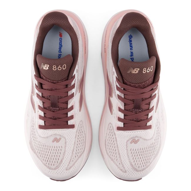 Top down view of the New Balance 860v15 pair in pale pink engineered mesh