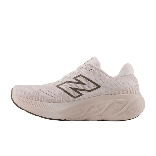 Medial side profile of New Balance 880 V15 women's shoe in pink salt showing Fresh Foam X midsole and structured mesh upper