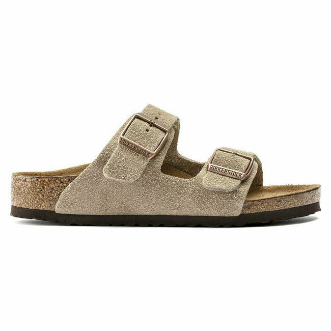 Side view of taupe suede Birkenstock Kids' Arizona sandals with two adjustable straps.