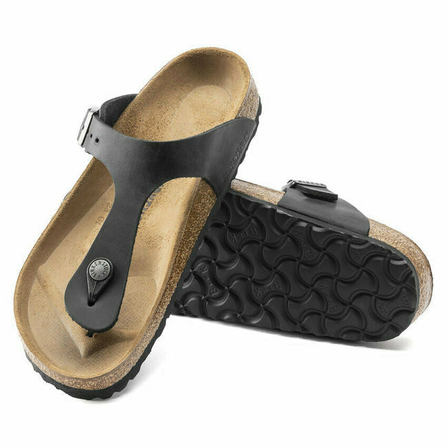 Pair of Black Birkenstock Gizeh oiled leather sandals. One showing the sole and the other the upper
